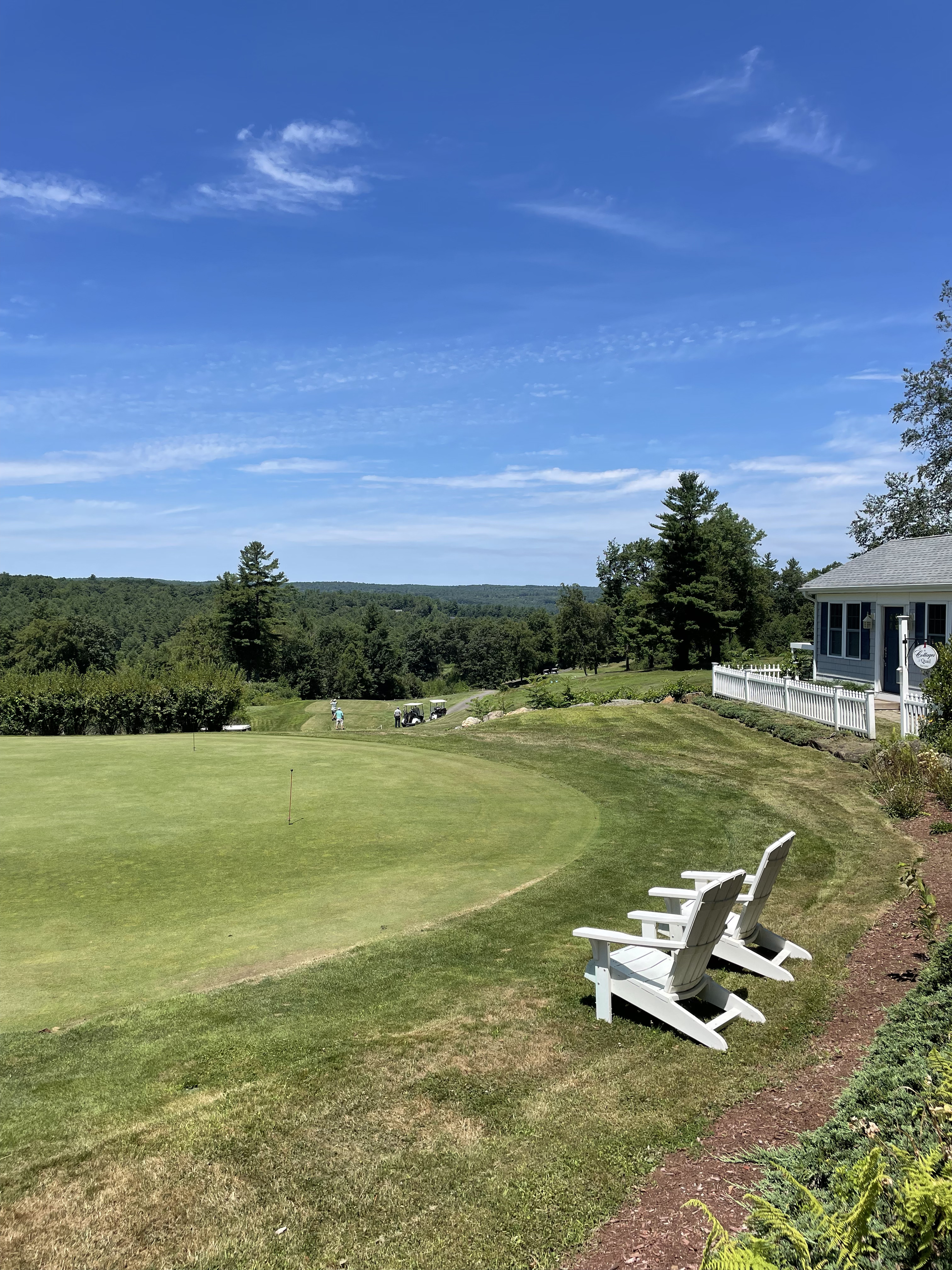 Adirondack chairs overlooking golf course